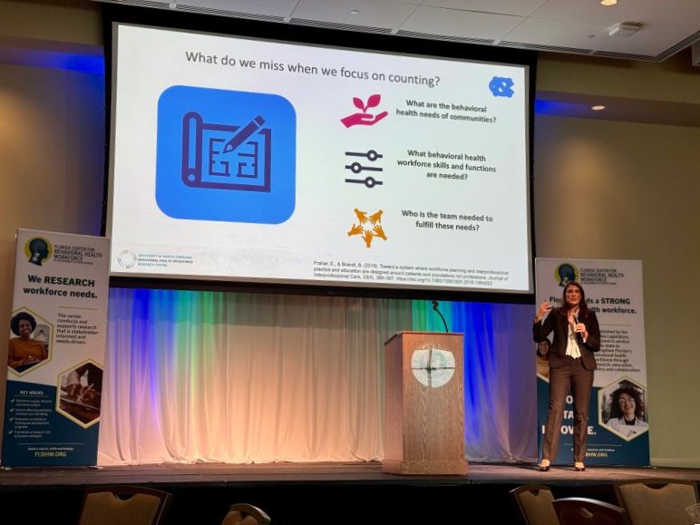 Brianna Lombardi presenting on stage