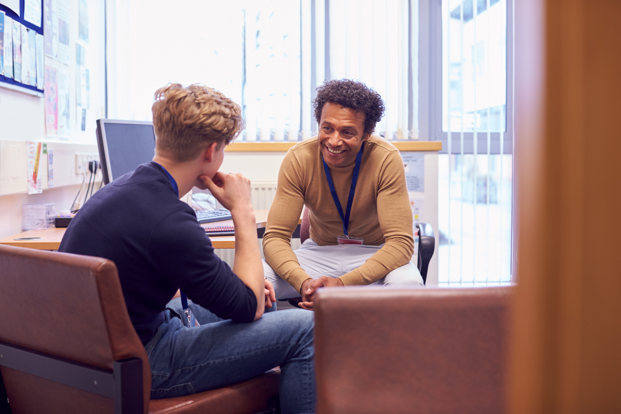 Peer support provider talking with young peer support provider trainee