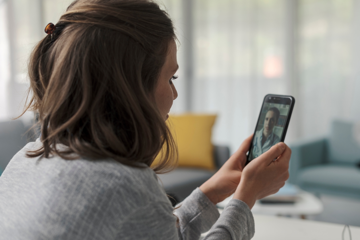 Woman having telehealth call with a provider