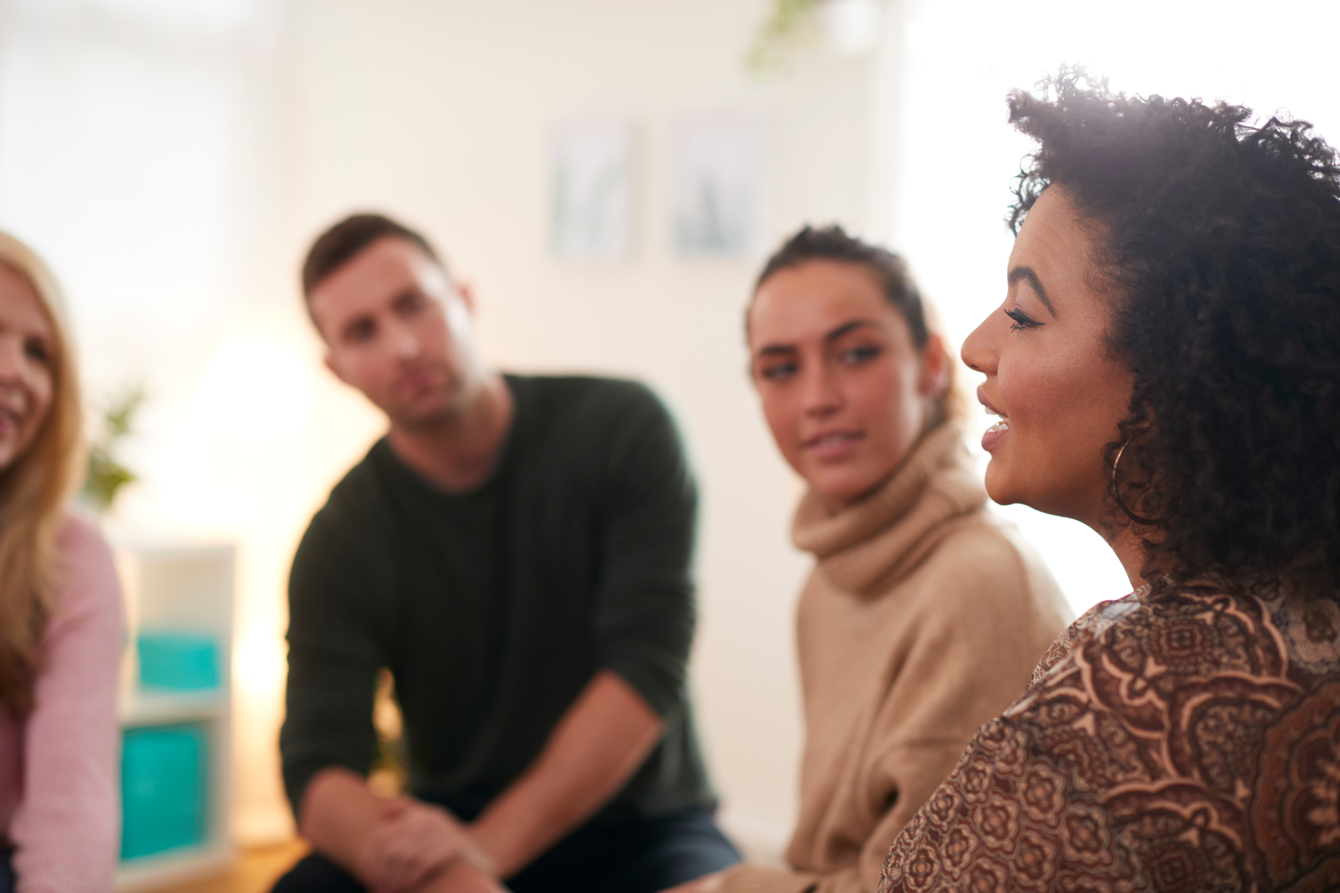 Peer support group leader leading a session